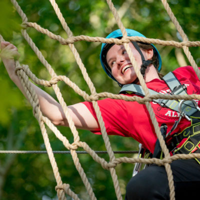 Girl climbing in the octagon rope latter