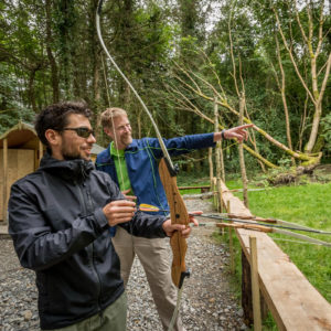 Archery Men practicing bow and arrow