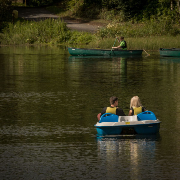 Boating & Canoeing Castlecomer Discovery Park Couple in a boat and man in canoe on lake
