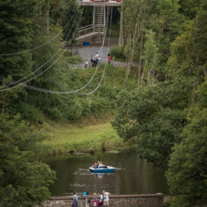 Zipline over bridge Zipline, bridge and boat on lake