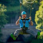 Man on zip line in the sunshine 2