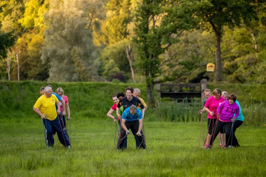 Group during team building exercise giant skis