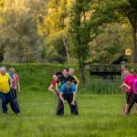 Group during team building exercise giant skis