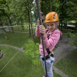Girl on junior high ropes course