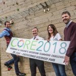 IKIP-W19-18 Core 2018 Launch-9 Business people with Core2018 sign