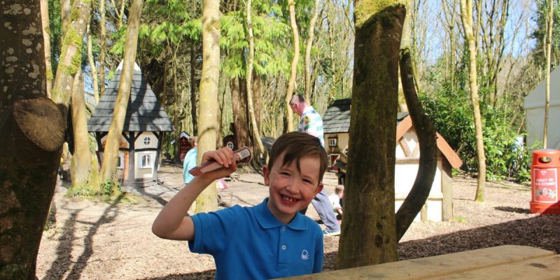 child with ice cream in elf village 2