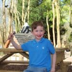 Young boy with ice cream in elf village
